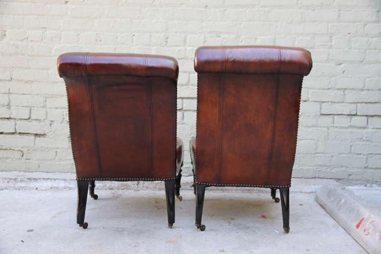 Pair of Leather Upholstered Side Chairs Standing on Casters In Distressed Condition In Los Angeles, CA