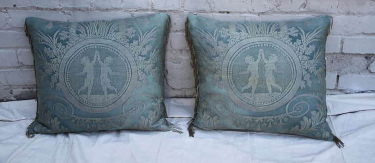 Pair of custom pillows made from authentic soft blue & silver Fortuny textile with linen backs and antique metallic silver trim.