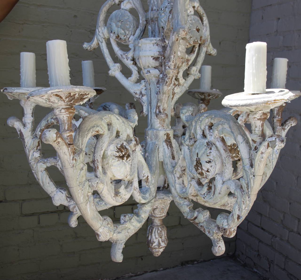 Six-light Italian white painted chandelier with wax candle covers. Newly wired with chain and canopy.