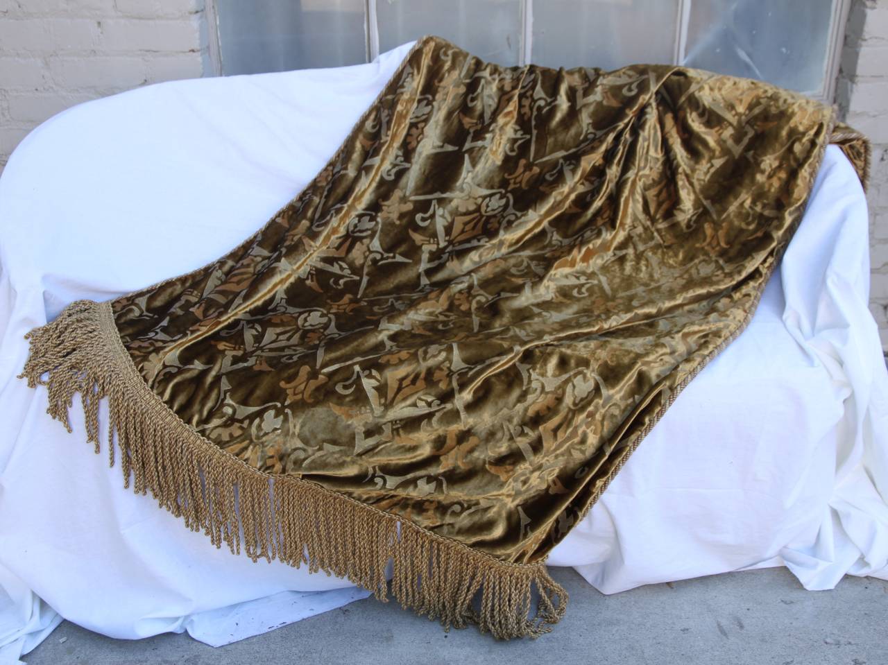 Custom hand stenciled velvet Nomi textile throw with long bouillon fringe and cord trim detail.