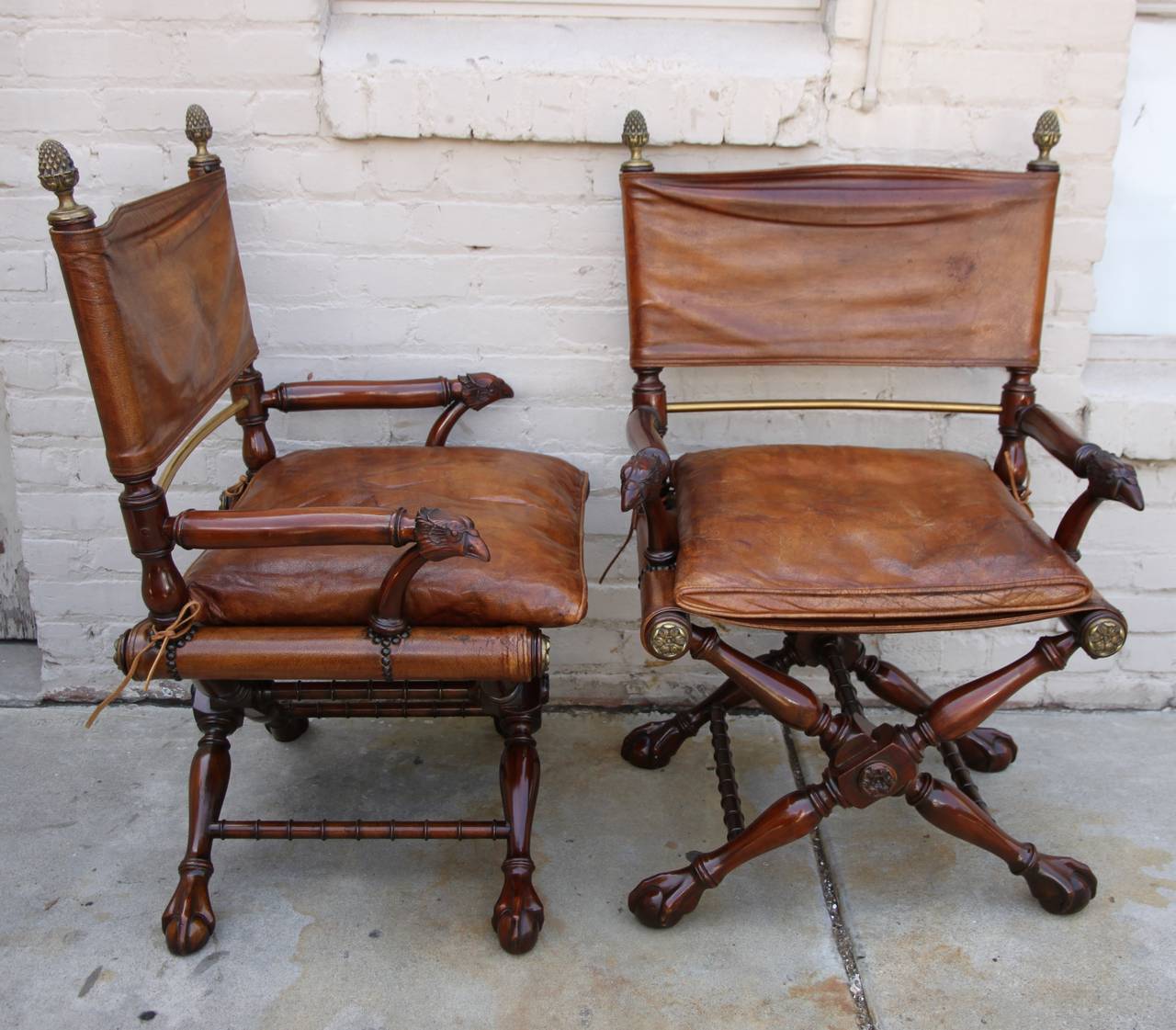 Pair of early 20th century American mahogany, leather and brass Campaign style armchairs.