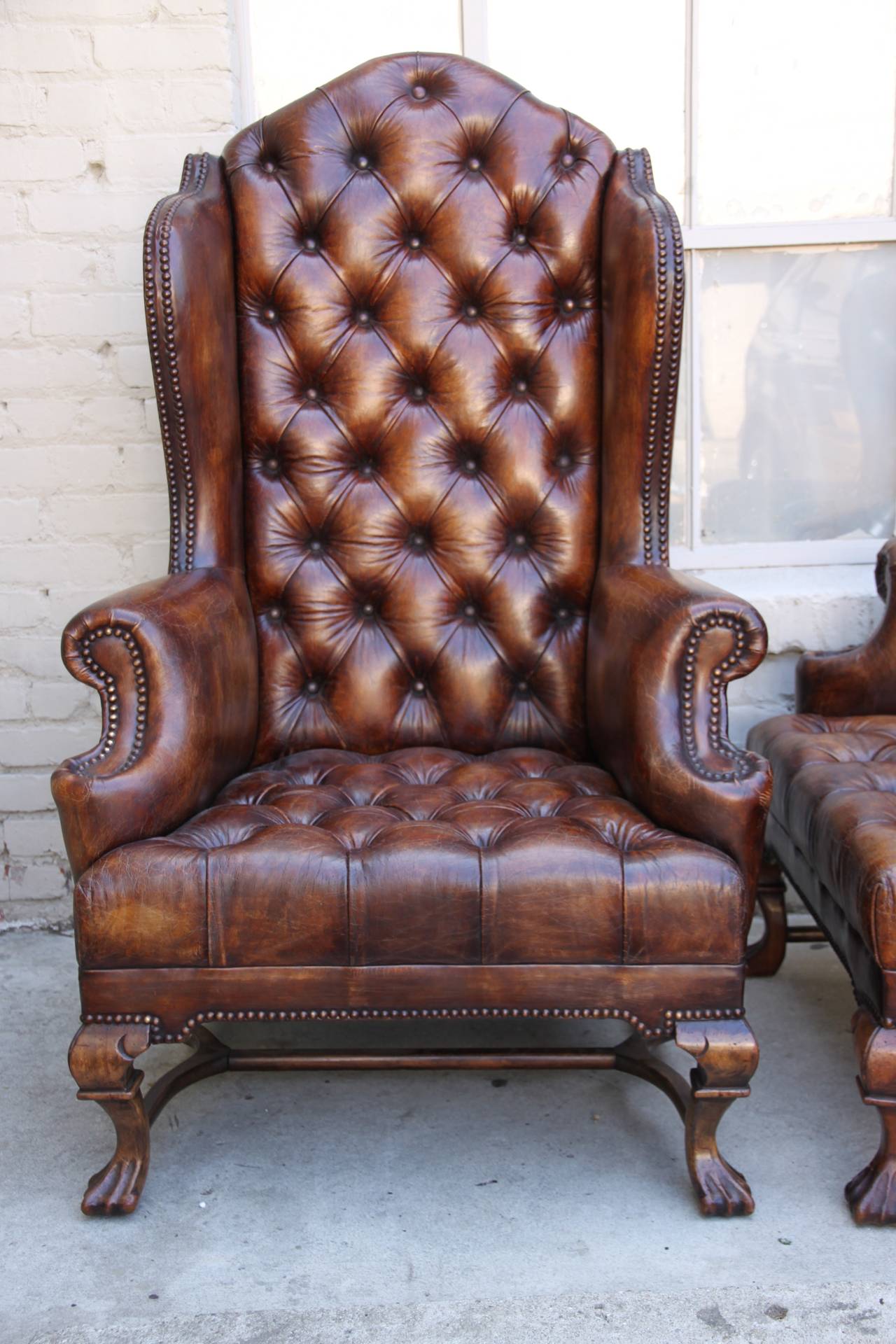 Pair of English Leather Tufted Armchairs In Distressed Condition In Los Angeles, CA