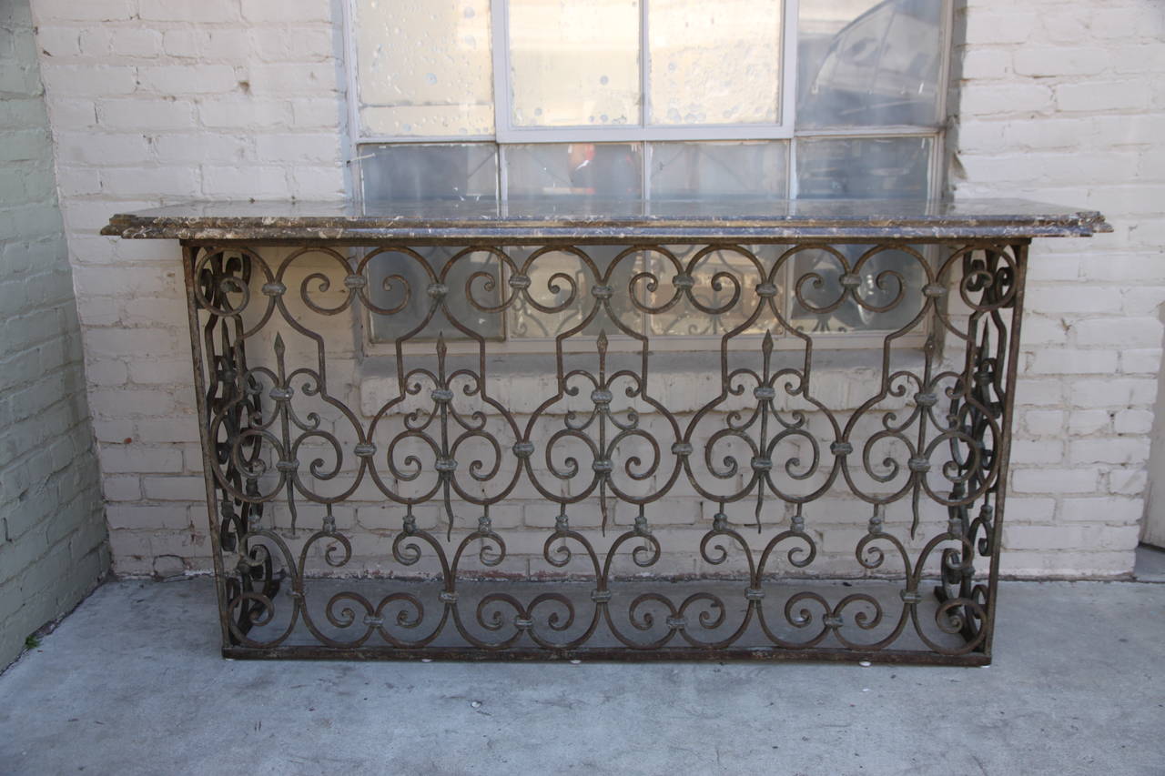 Spanish Revival wrought iron console with breccia marble top.