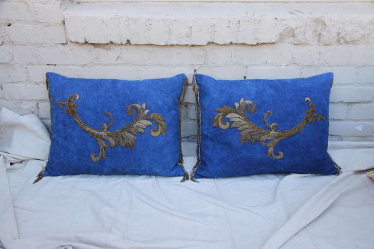 Pair of custom pillows made from 19th century hand made metallic & chenille acanthus leaves appliqued on over-dyed heavy linen with antique silver metallic fringe on sides. Down inserts.