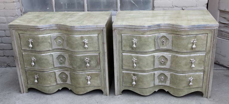 Pair of three-drawer soft green painted and silver parcel-gilt commodes with silver metal leaf hardware.