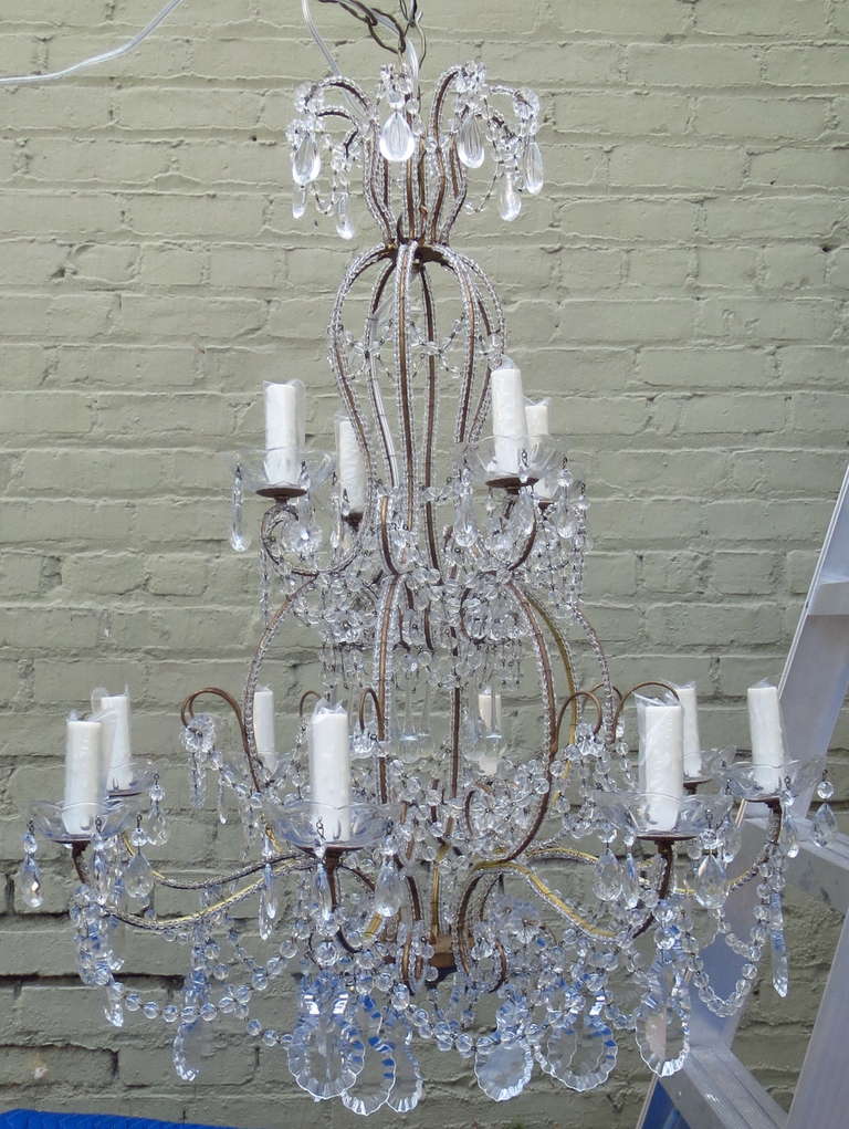 Italian (12) light, two-tiered crystal and macaroni beaded chandelier. Newly re-wired with drip wax candle covers. Chain and canopy included.