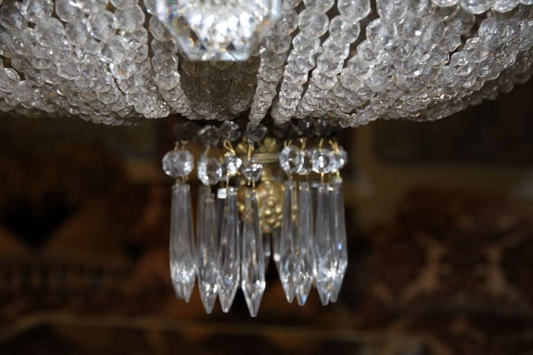 19th century French crystal beaded and bronze chandelier. Newly wired and in working condition.
