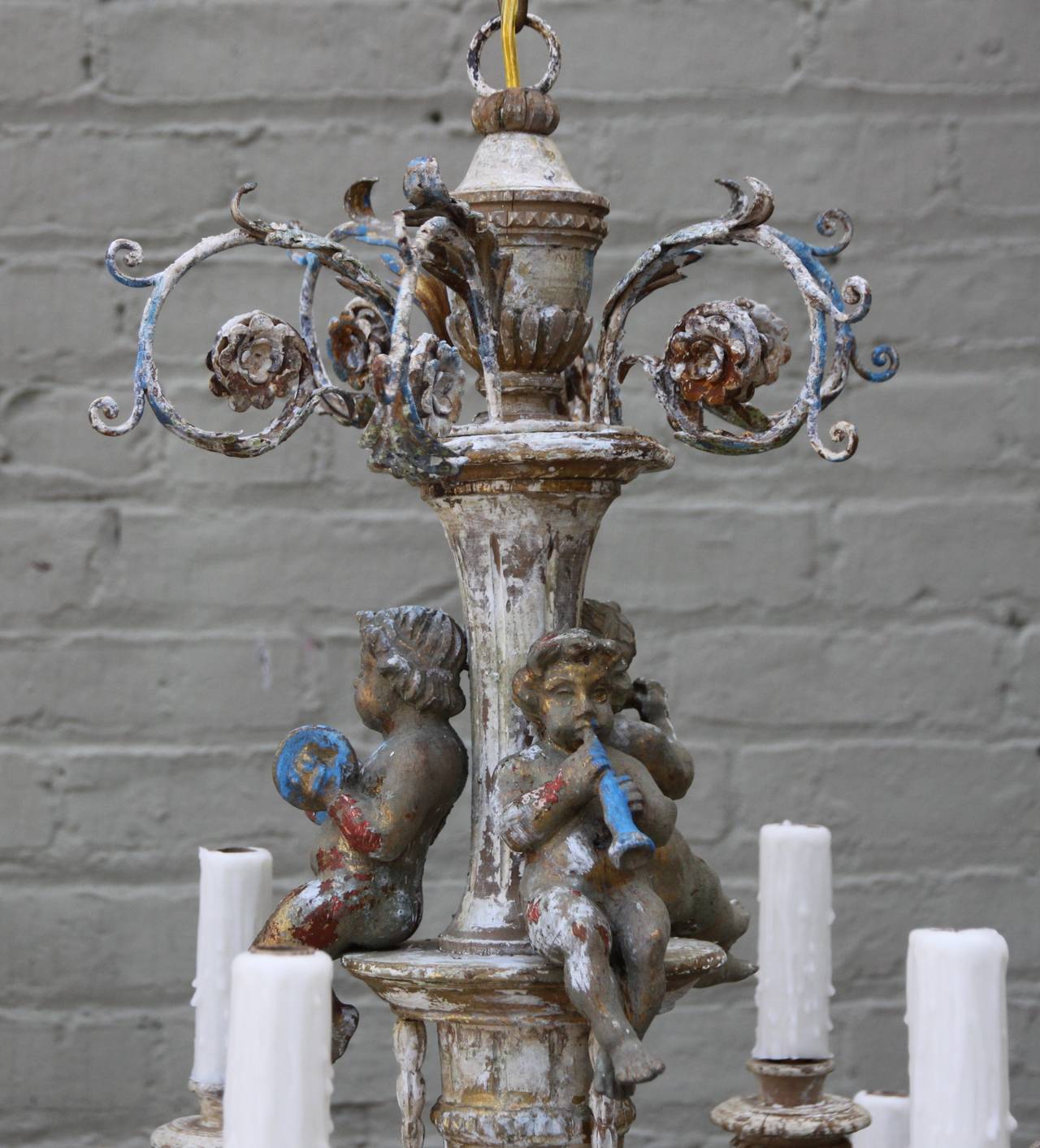 Rococo Twelve-Light Iron and Wood Cherub Chandelier