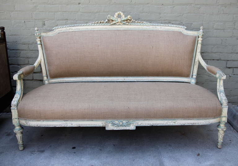 19th century painted Louis XVI style settee newly upholstered in burlap upholstery with self cording.
