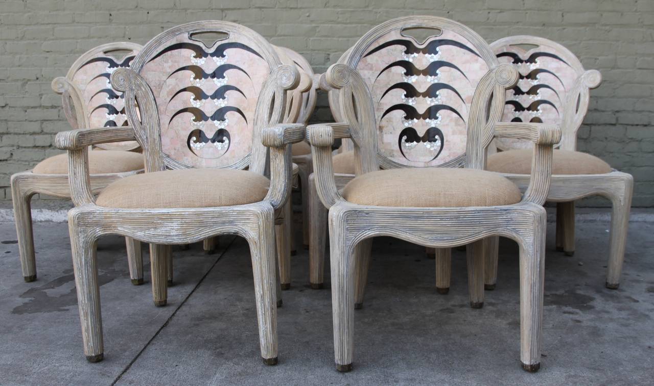 Set of unique travertine, wood and mother-of-pearl inlaid dining chairs newly upholstered in burlap textile.