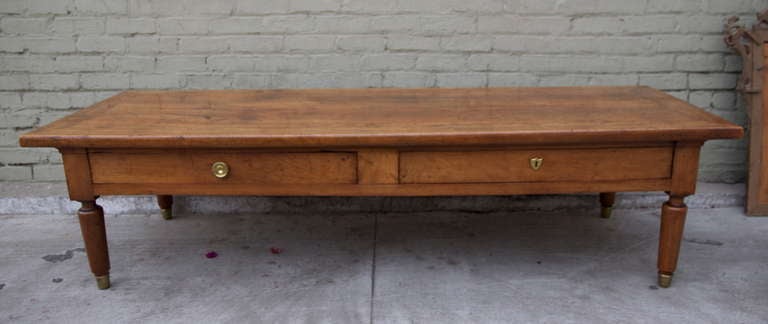 French walnut table with two drawers with brass hardware. Reduced in height.