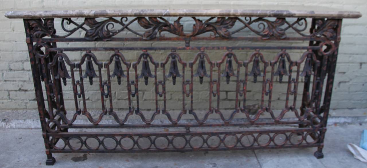 Pair of Spanish Revival wrought iron consoles with breccia marble top.