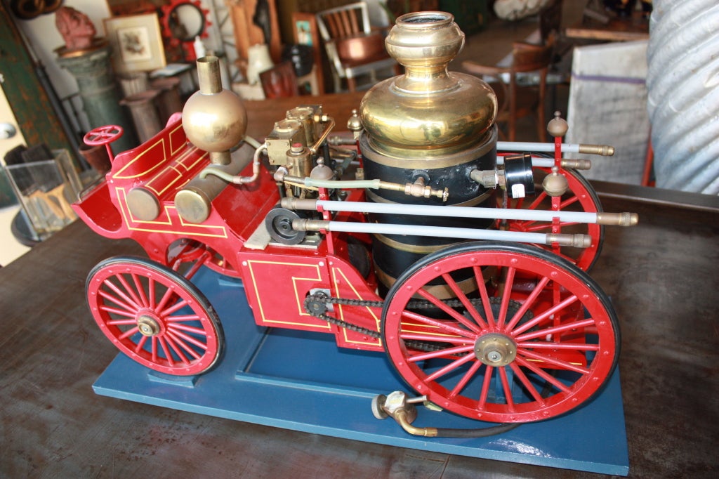 Wild model of a steam driven fire engine that can be heated with a  propane connection.Great detail.Mounted on a stand that will allow rear wheels to turn in place.Twin cylinder.