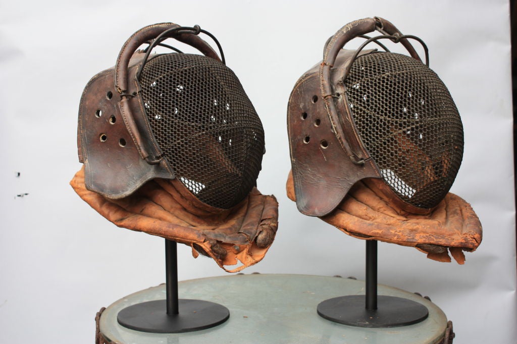 Old masks complete with leather bibs. Great original patina.