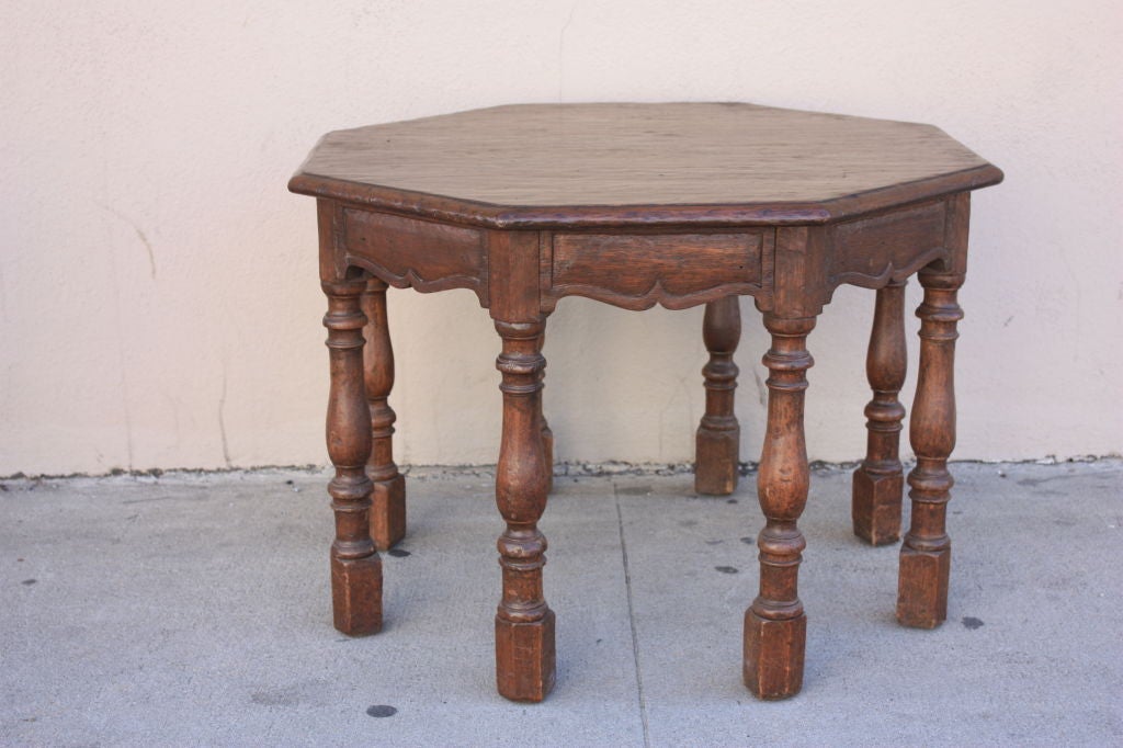 Walnut 8 legged table handmade in the 1920's by the Marshall Laird company in Los Angeles.All their furniture was custom made and of the highest quality.