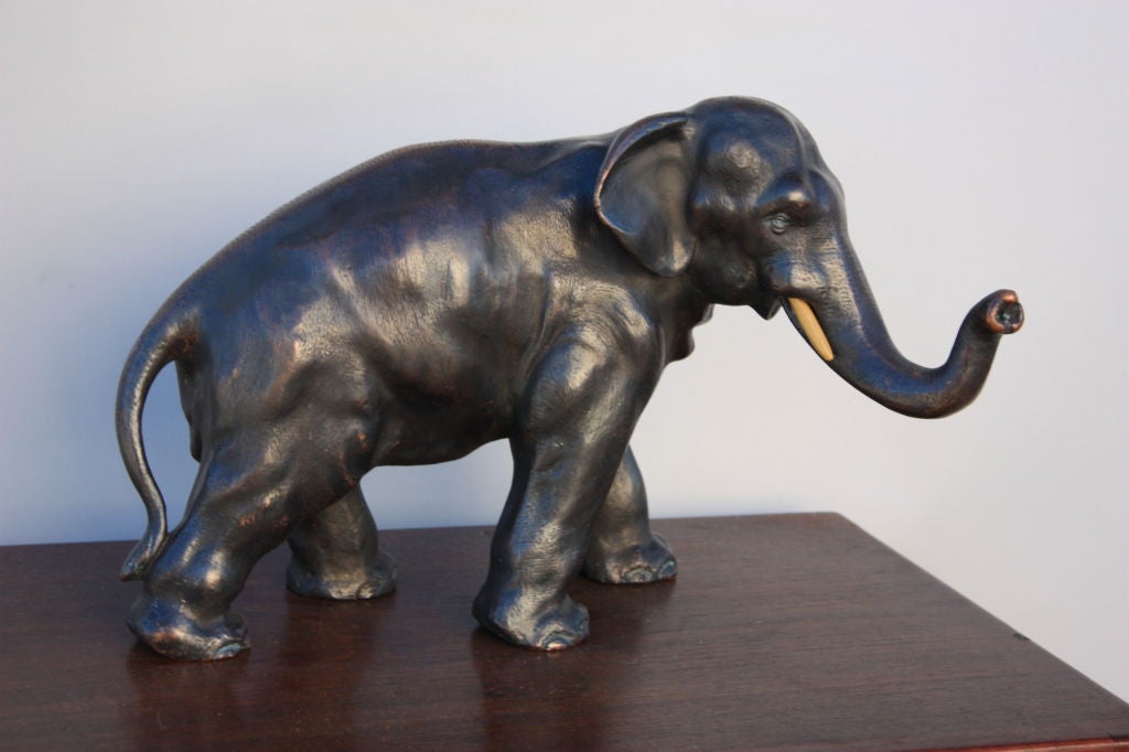 Great scale to this good size elephant.Nice patina also for you animal lovers.Feels and weighs like bronze.