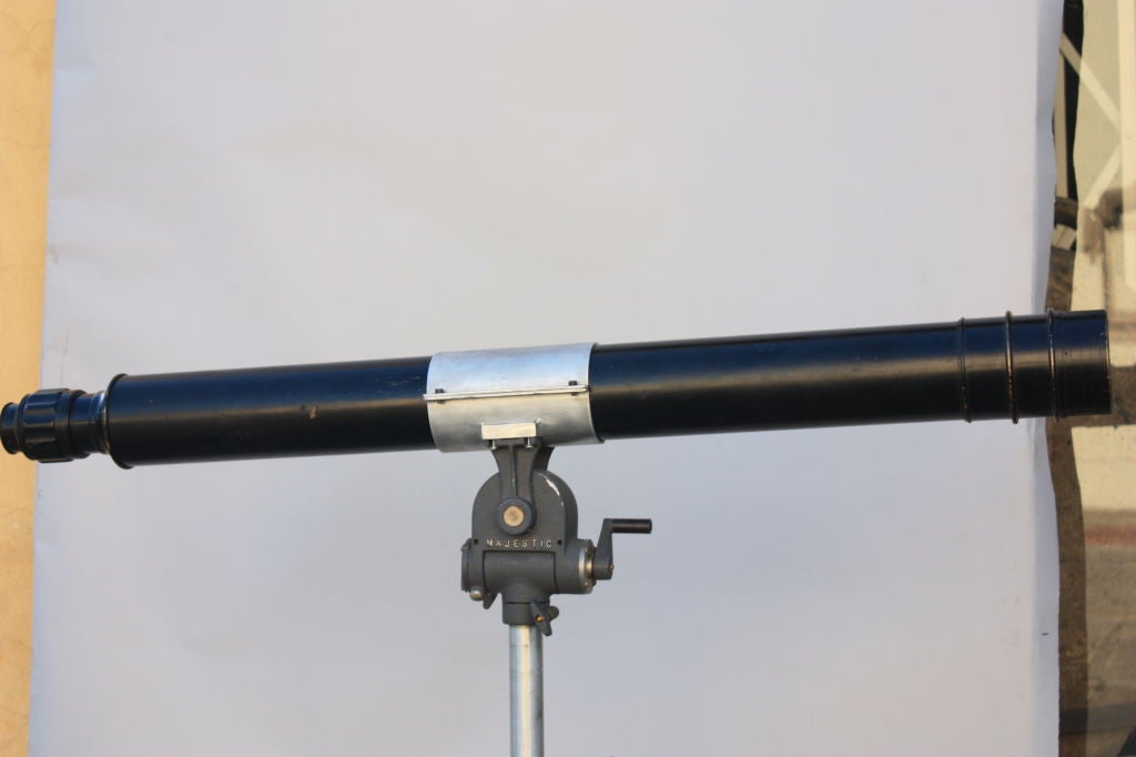 Old telescope mounted on a more recent stand. Find out what your neighbors are doing. Great optics. Fully adjustable.