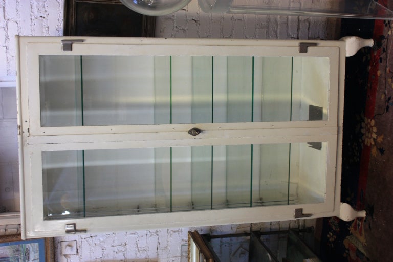 Great original medical cabinet with 5 adjustable shelves. Beveled glass on front and sides. Very clean and can be used for display or storage.