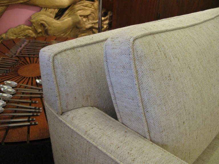 Nice Mid-Century Sofa all newly upholstered and ready to go!  Back cushions are down-filled with a foam wrap to keep their shape.  Walnut legs have a brass stretcher that show in the front of leg, very nice detail.