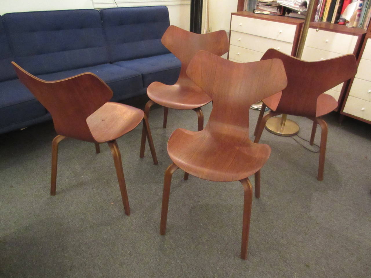 Set of four 4130 chairs by Jacobsen in teak. Completely original with no chips but two chairs do have very small impressions from 60 years of stacking (shown).
