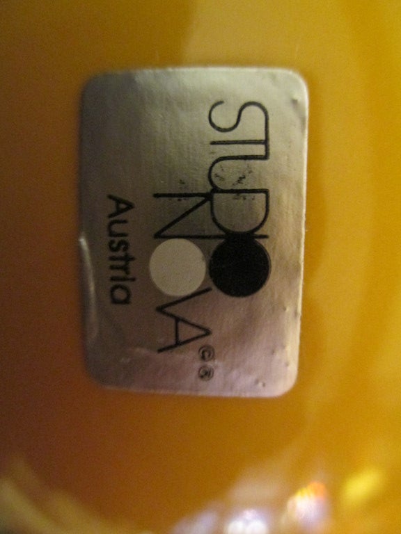 Set of five vases in four sizes of highly glazed peach colored ceramic with dark orange rims.  Each piece is signed and one has Studio Nova foil label. Measurement listed is for largest vase 