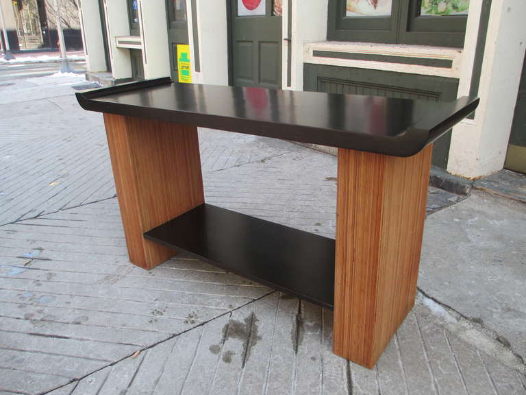 Handsome console with dark chocolate lacquered top and single shelf recently re-lacquered.  Cerused oak has been cleaned and sealed. Matching lamps, buffet and end table available in same finish and tone.