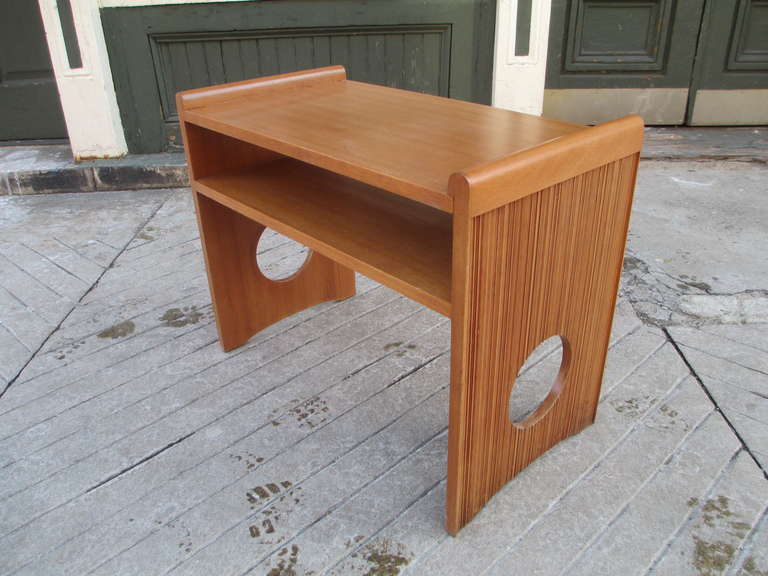 Side table by Paul Frankl for Brown and Saltman in cerused oak with mahogany shelves.  This table shows faint Brown Saltman stamp to underside. Two port hole cutouts on either support give this piece a real Art Deco feel.  A pair of lamps, buffet