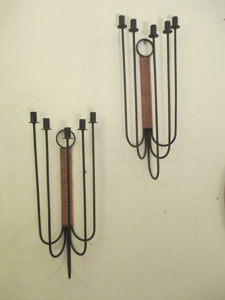 Pair over sized wrought iron five pronged sconces with rattan spine by Raymor