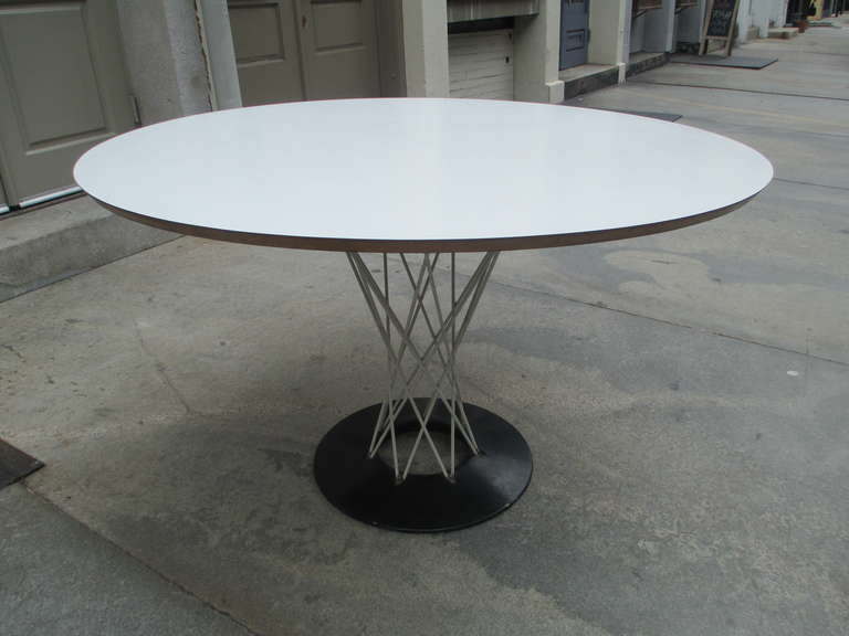 Noguchi round dining table pre 1964 Knoll Associates often called the Cyclone. Bought from the original owner in Bryn Mawr Pa.   The Base is in the white Knoll latex finish to match the Bertoia chairs that have been with it since it was bought