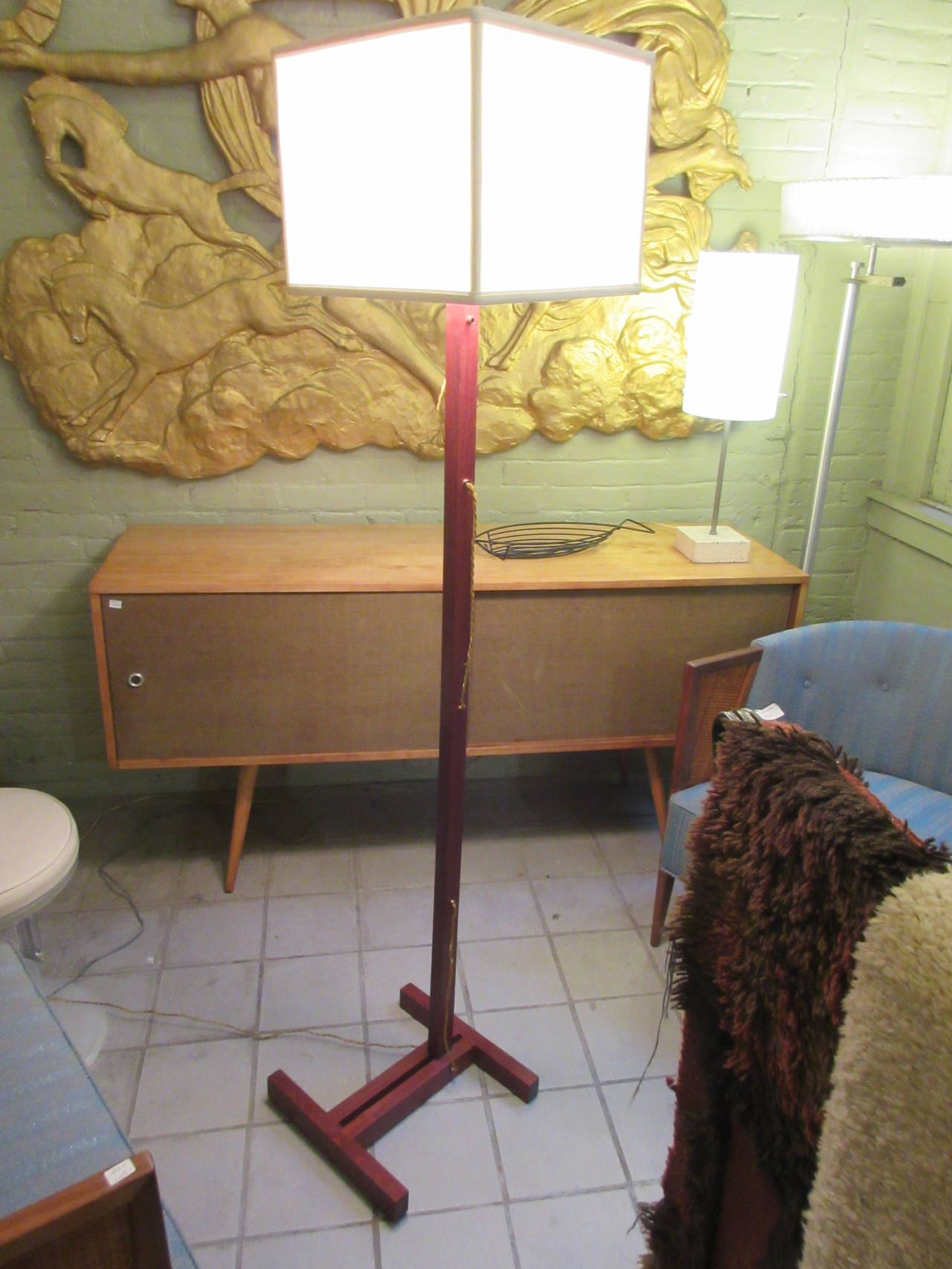 Handcrafted solid walnut lamp with cube shade. Twisted silk wire is exposed in and up and over pattern from outlet to lamp socket.