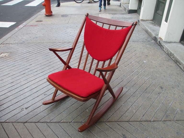 Solid teak Danish rocker from 1958 with modernist shaped cushions of soft wool hopsak fabric.  Comfortable and sturdy.