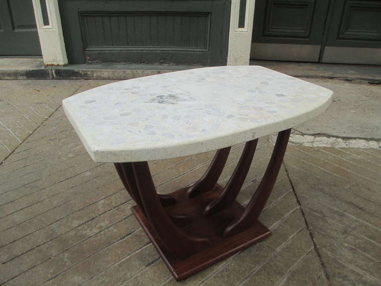 Great Terrazzo topped boat-shaped end table by Harvey Probber.  Nice thick top sets this off beautifully with inlaid chunks of stone.  Top is in amazing condition and walnut is very clean!