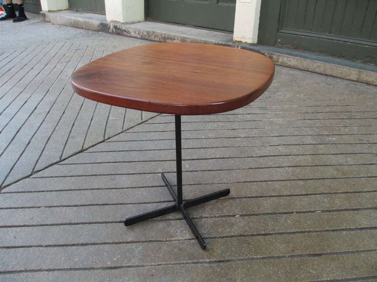 Solid walnut side table with hand wrought base of iron.  Simple sturdy and charming. Bought from original owner