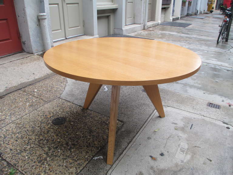 No longer available 48 inch diameter oiled oak table by Jean Prouve for Vitra Design. Two chairs available for $950 the pair.