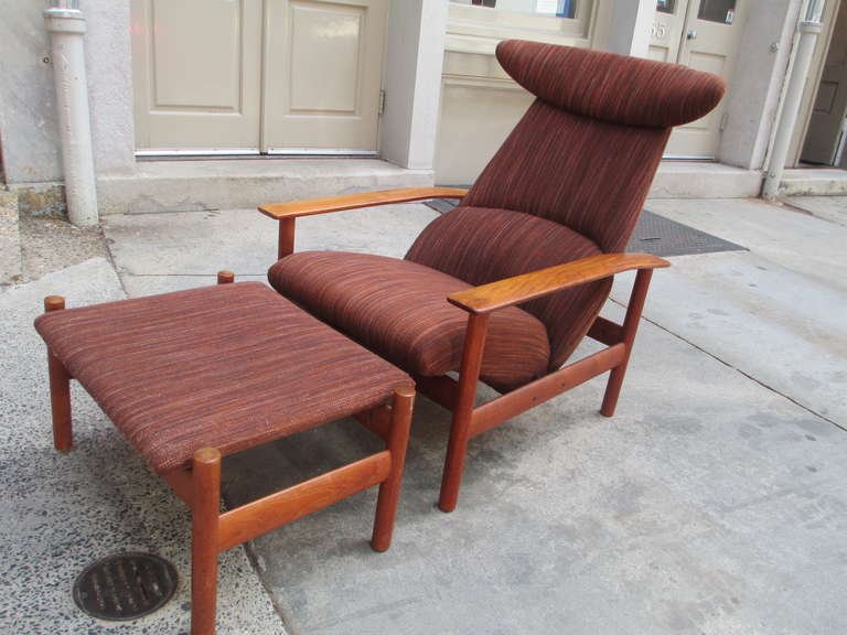 Fabulously comfortable solid teak chair and ottoman by Dokka Mobler of Norway. Ottoman connects to chair via an ingenious coupling device.   The chair itself has two positions, comfortable and totally relaxed.  The ottoman retains the original metal