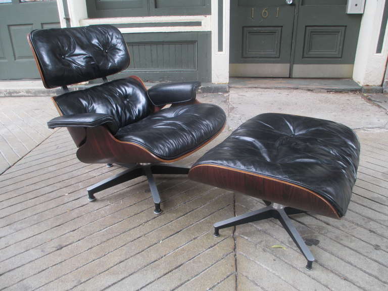 60's or early 70's Rosewood Eames Lounge Chair and ottoman with original leather and refilled down cushions.  New zippers have been sewn into two large cushions.  Rosewood is exceptionally strong and deep in tone!  Leather has been cleaned and