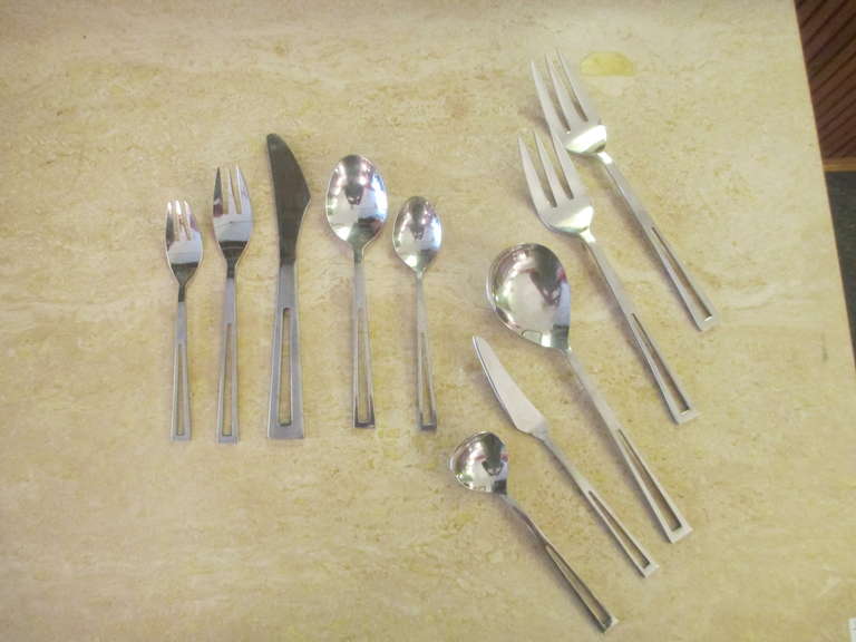Aperto is a stainless flatware set based on a Mexican sterling design.  Made by Stanley Cutlery in japan in the 1950's.  This service has twelve place settings of Dinner fork, salad fork, soup spoon, teaspoon, and knives with two serving forks, one
