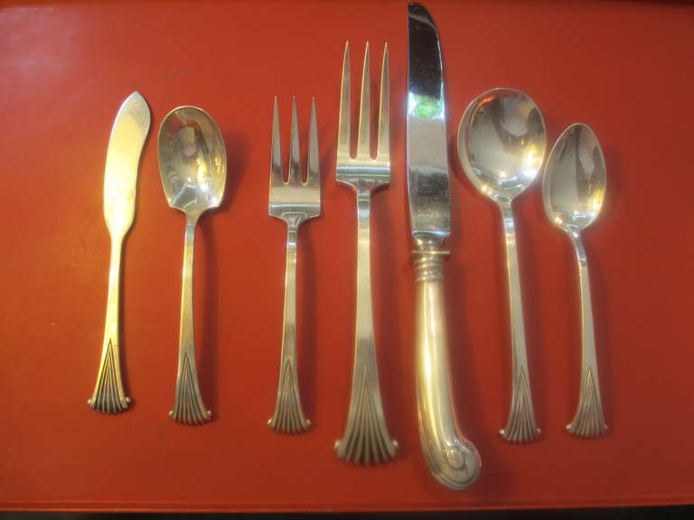 Beautiful, Elegant Service for 8 plus 7 butter knives and sugar spoon.  Design is very simple with a scallop end to each piece.  Knife is especially beautiful and very nice weight!  Set dates to late 50's, Tuttle Sterling put the initials of current