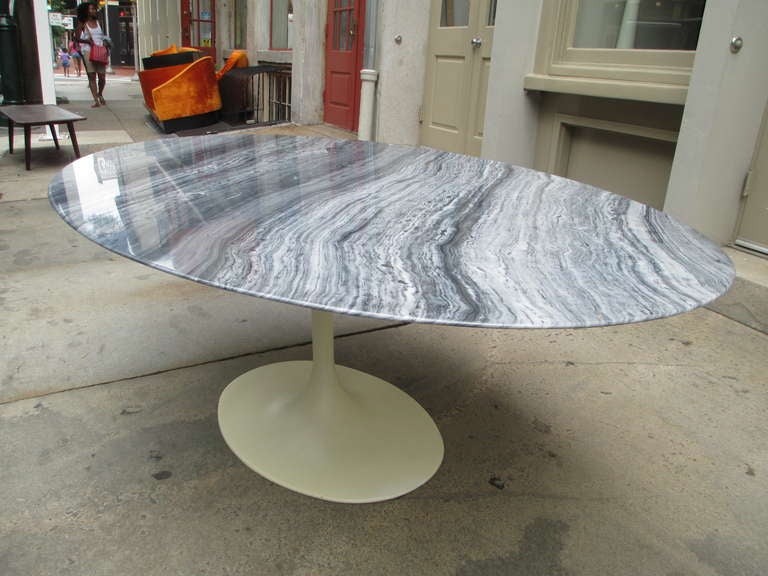 A non-Knoll  addition of Eero Saarien's iconic pedestal table.  Marble is a stunning grey-grained marble with proper Knoll style beveled edge on a oval-cast aluminum base.  This is a very good copy of the original design.  
