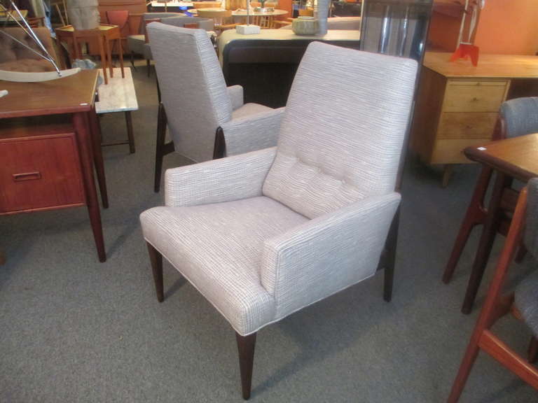 This pair of arm chairs are large and comfortable but have a very petite foot print.  The last part of the back rest provides additional lumbar support.  The solid walnut frame's back legs are attached in a buttress formation.  Chair have been