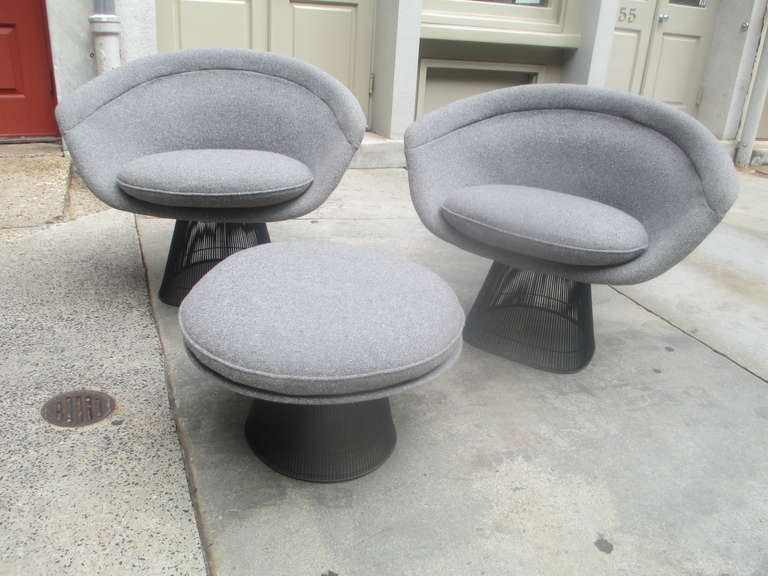 Produced for just a short period in the 70's this black version is seldom seen.  Two Lounge chairs covered in a gray weave fabric.  Chairs were upholstered roughly 15 years ago.