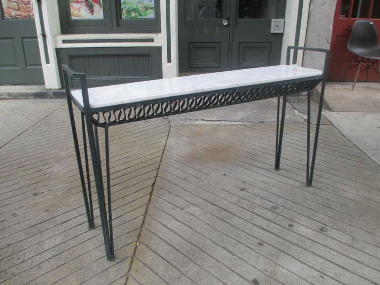 John Salterini, an immigrant from Italy, began designing and manufacturing wrought iron garden furniture from his studio in Brooklyn starting in the late 1920s.  He is known for the resurgence of wrought iron furniture in popular design.  This