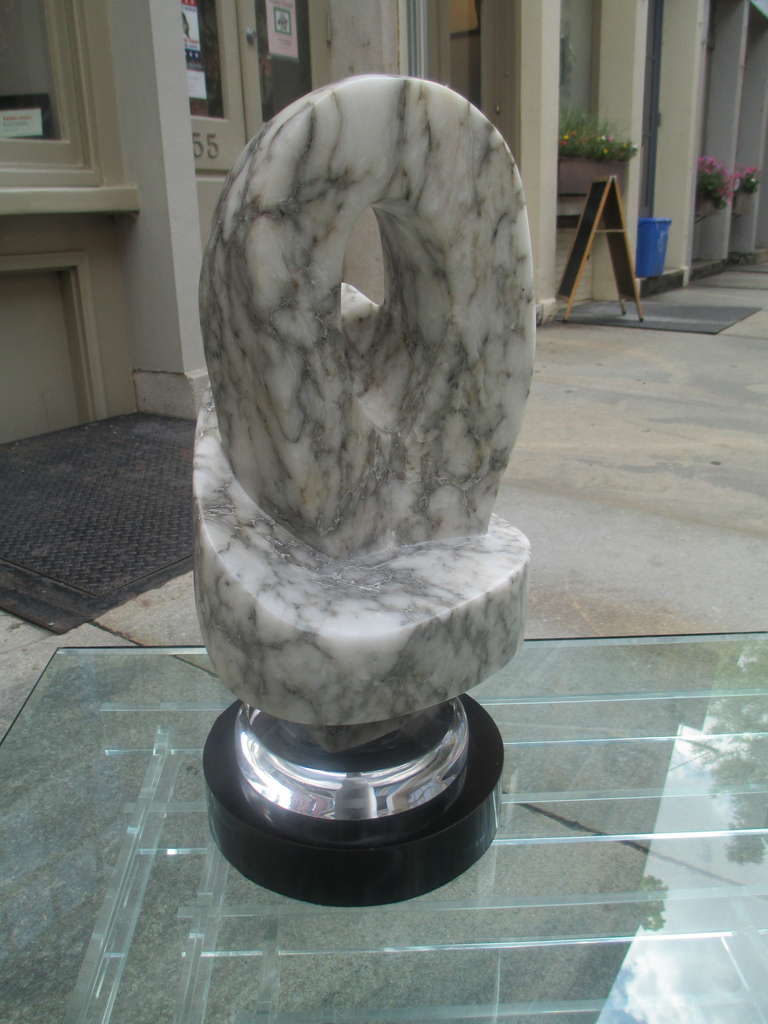 Large marble freeform sculpture on laminate and Lucite base. Unsigned.