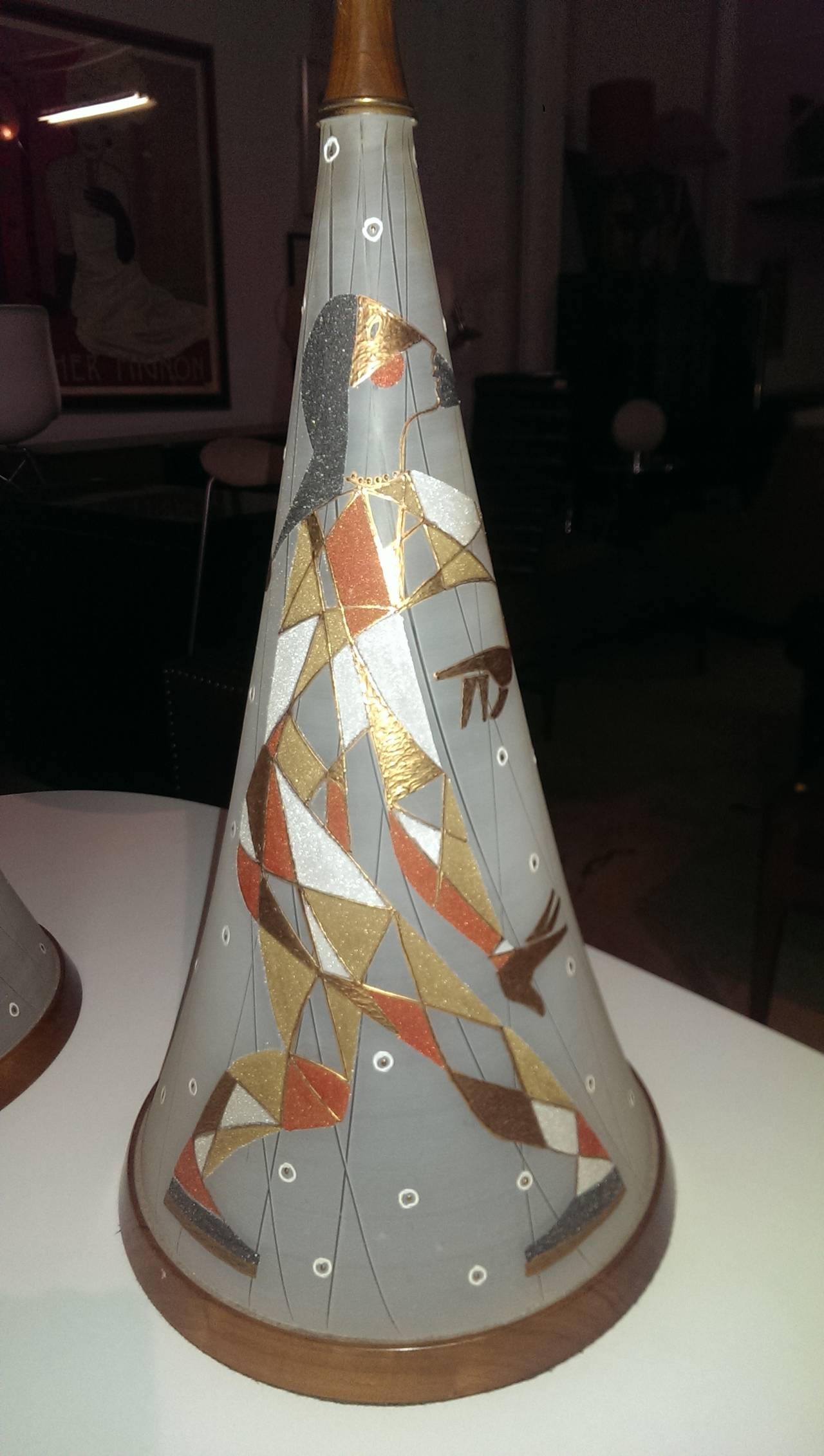 Incredible large 1950s lamps of hand-painted Harlequins on glass cones capped at both ends in wood and brass with tall cylindrical shades.