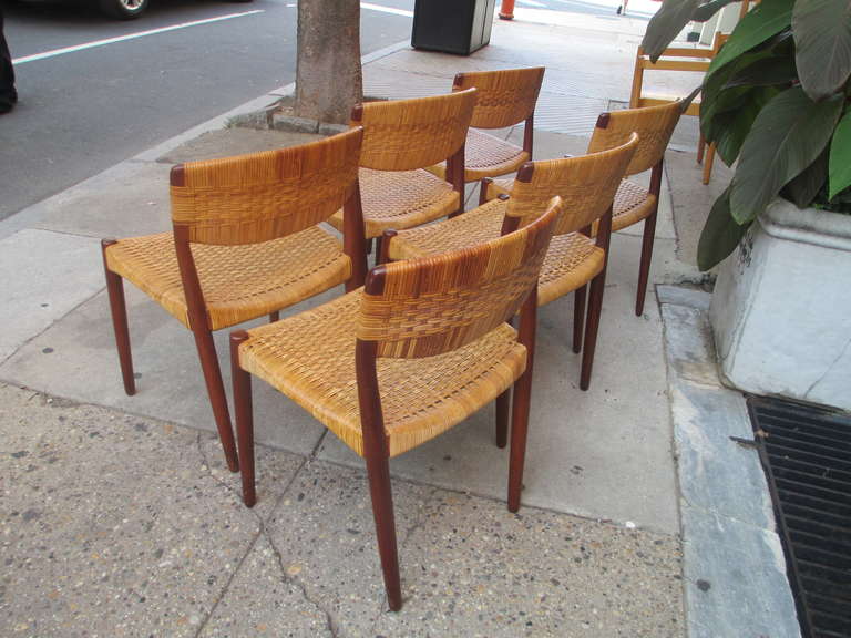 Six Solid Teak and Caned Chairs 1