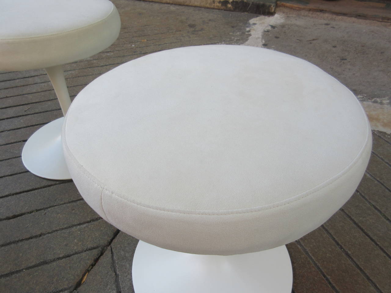 Knoll Saarinen stools with white ultra-suede three available. Bought from original owners. Specified by Hugh Newell Jacobsen's Architect of 