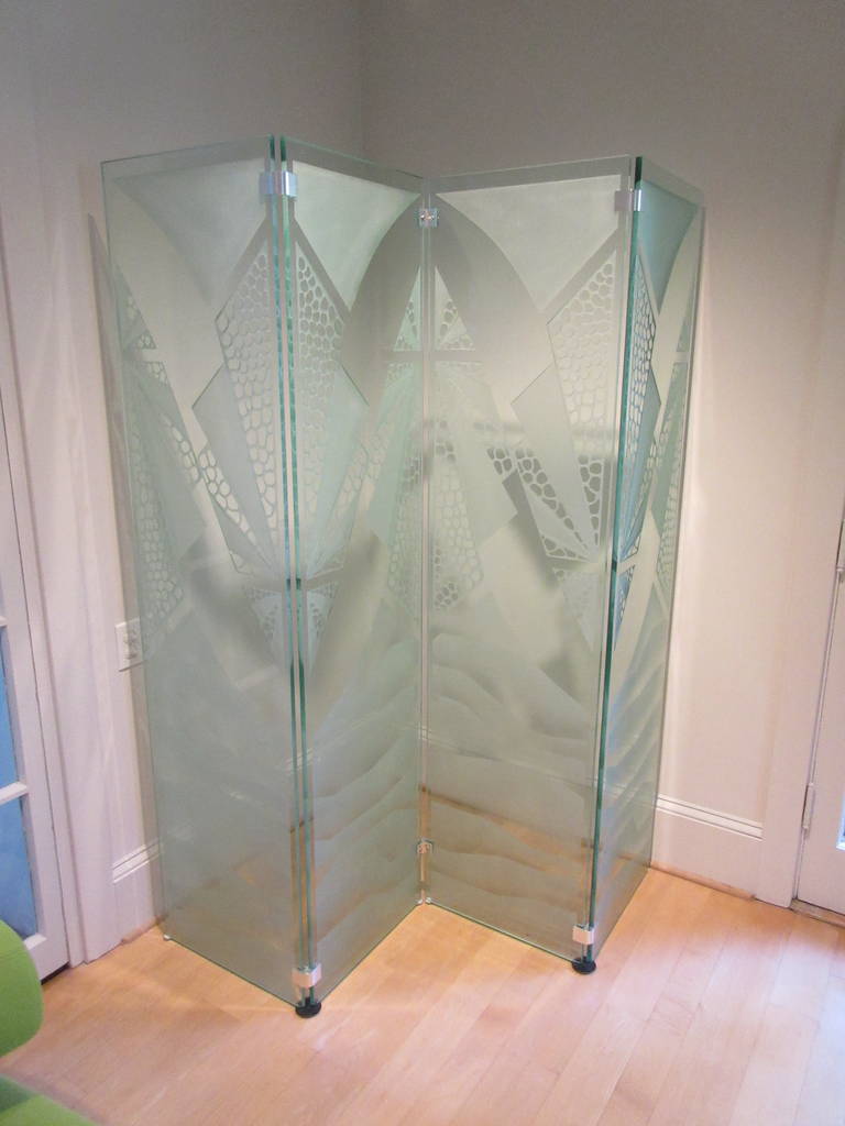 Stunning four large acid etched glass panels held together with six aluminum fasteners at three 90 degree angles. The screen does not flex but is static. Etching is geometric and organic at the same time. Created in the 1990s for a Wilmington home.