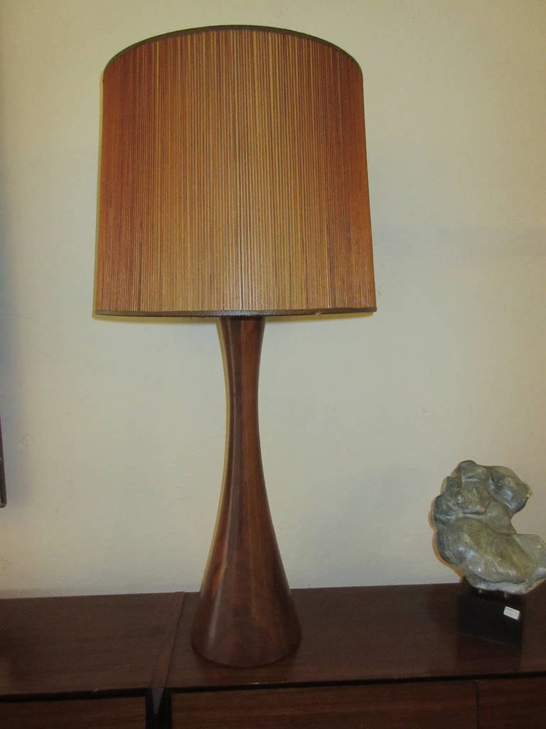 Large solid walnut table lamp with split bamboo shade in the style of American Woodworker Phillip Powel.  All there and all original.