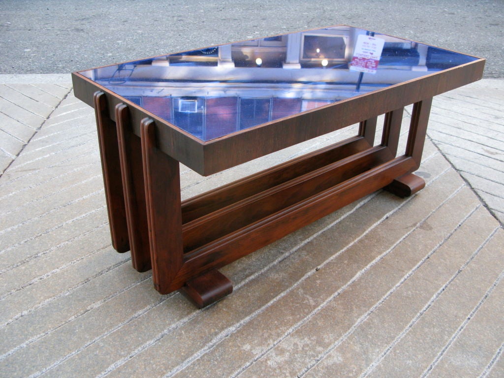 All Original Mahogany Cocktail table with original blue mirror top.  Table has great lines with three horizontal bands that suppport a framed piece of blue mirror.