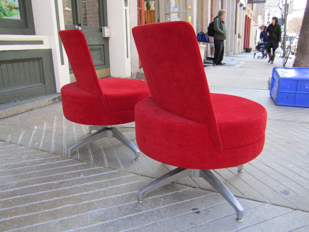swivel lounge chairs in velvet on cast metal base made by the Metropolitan company and distributed by Steelcase.  Sold as a Pair.  An additional pair of medium blue velvet chairs are available as well.  As oa 9/9/11 the red pair have sold.